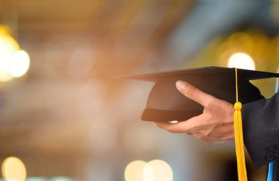Graduation cap and academic books